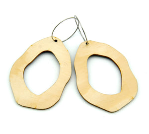 Back of wooden earrings named ‘Rock Hollow Light’ shaped as a natural rock. Made from sustainable wood with stainless steel hoops. Made in Australia.