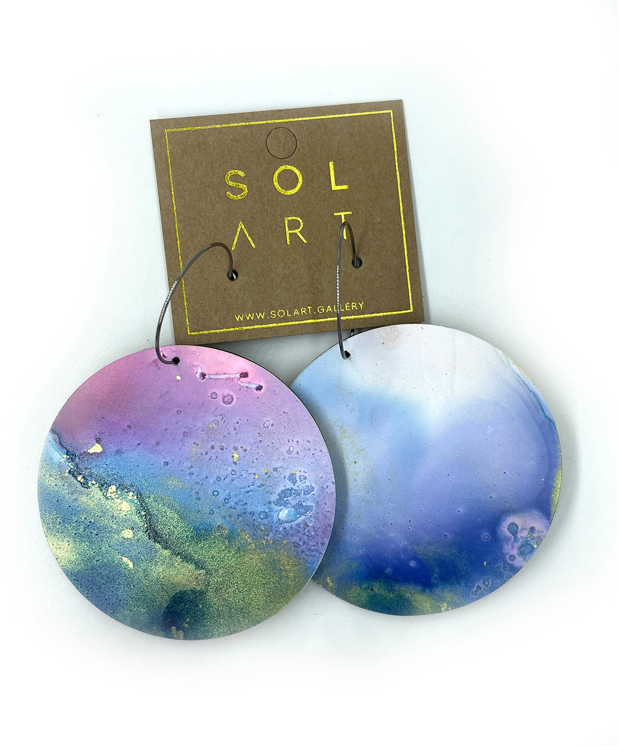 Shop women's wooden earrings named 'White Beauty Statement shaped as a disc. Painted with inks on Yupo paper with stainless steel hoops. Made in Australia.