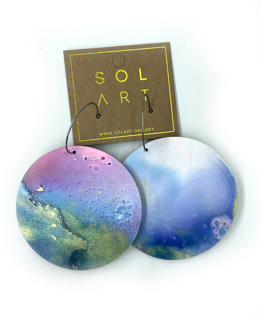Shop women's wooden earrings named 'White Beauty Statement shaped as a disc. Painted with inks on Yupo paper with stainless steel hoops. Made in Australia.