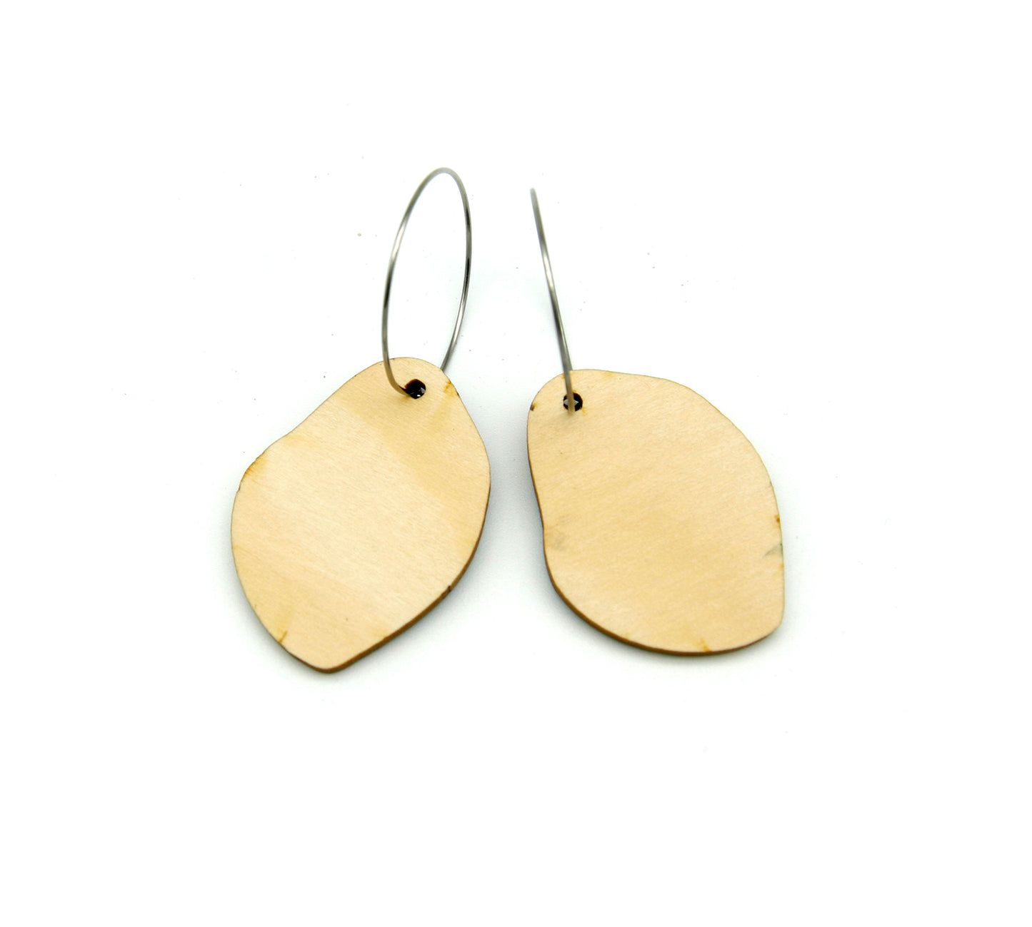 Back of wooden earrings named ‘Rock Drop Ground’ shaped as a natural rock. Made from sustainable wood with stainless steel hoops. Made in Australia.