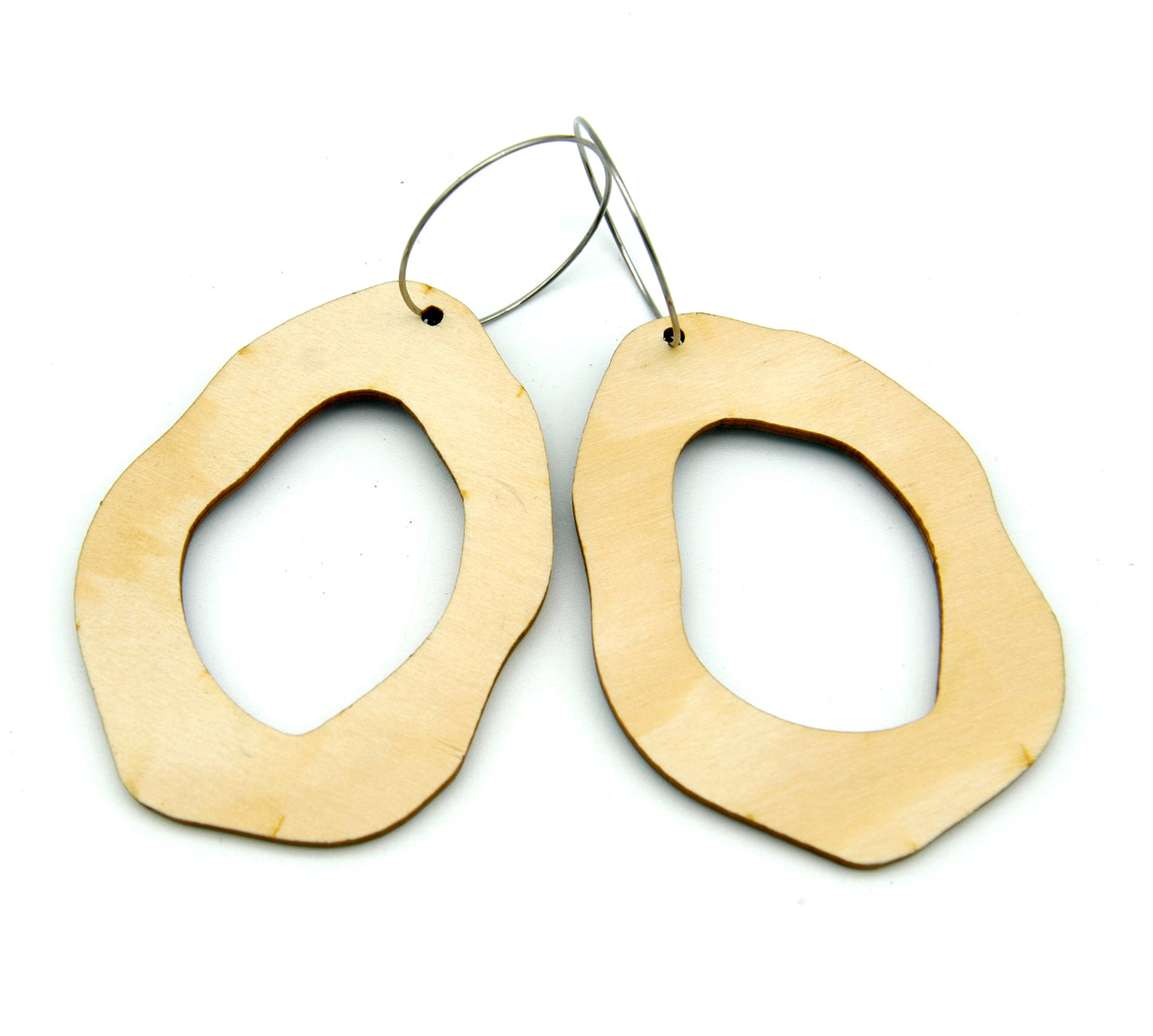 Back of wooden earrings named ‘Rock Hollow Ground’ shaped as a natural rock. Made from sustainable wood with stainless steel hoops. Made in Australia.