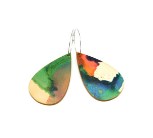 Shop women's wooden earrings named 'drop play' shaped as a rain drop. Made from sustainable wood with stainless steel hoops. Made in Australia.