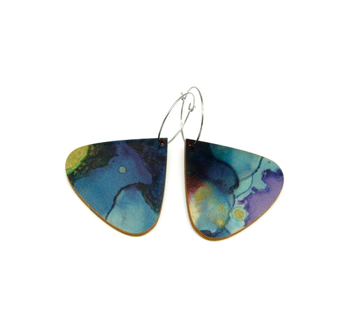 Shop women's wooden earrings named 'drop dive' shaped as a natural drop. Made from sustainable wood with stainless steel hoops. Made in Australia.