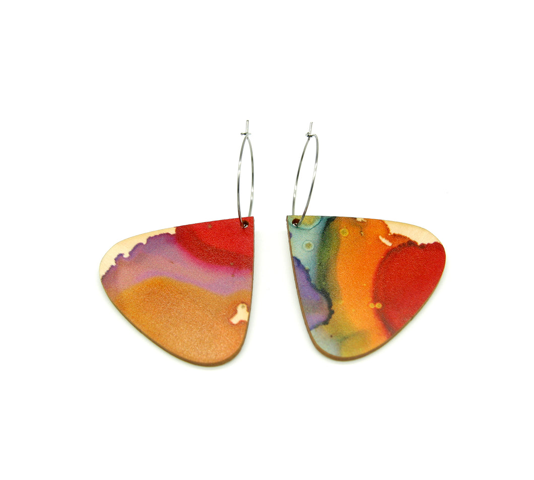 Shop women's wooden earrings named ‘droplet glow’ shaped as a natural drop. Made from sustainable wood with stainless steel hoops. Made in Australia.