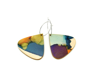Shop women's wooden earrings named ‘droplet ripple’ shaped as a natural drop. Made from sustainable wood with stainless steel hoops. Made in Australia.