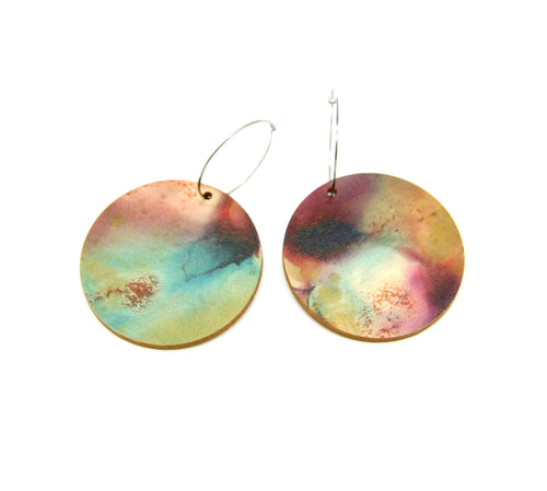 Shop women's wooden earrings named ‘Round 45 Flight’ with a round shape. Made from sustainable wood with stainless steel hoops. Made in Australia.