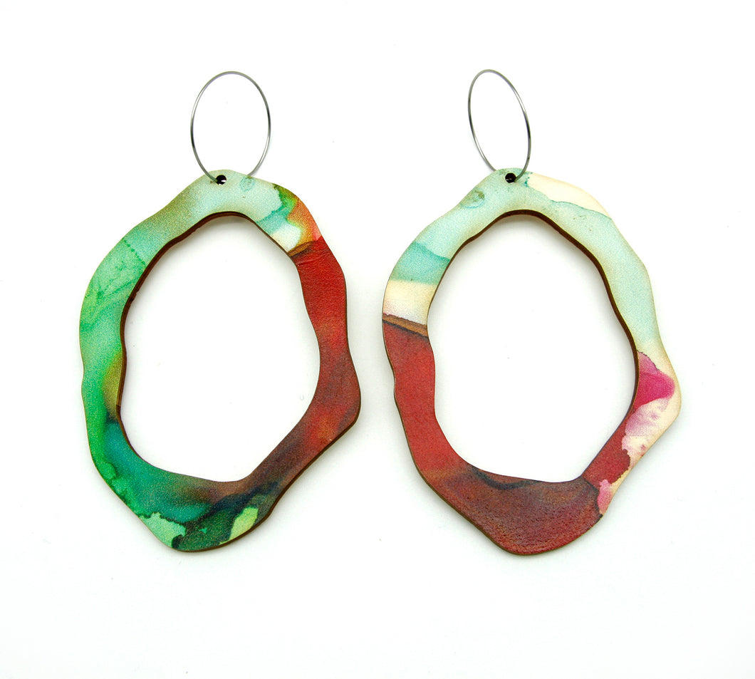 Shop women's wooden earrings named ‘Rock Hollow Delight Statement’ shaped as a natural rock. Made from sustainable wood with stainless steel hoops. Made in Australia.