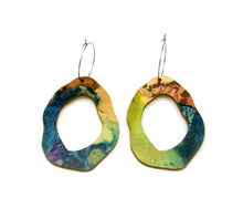 Shop women's wooden earrings named ‘Rock Hollow Ground’ shaped as a natural rock. Made from sustainable wood with stainless steel hoops. Made in Australia.