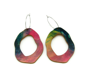 Shop women's wooden earrings named ‘Rock Hollow Heart’ shaped as a natural rock. Made from sustainable wood with stainless steel hoops. Made in Australia.