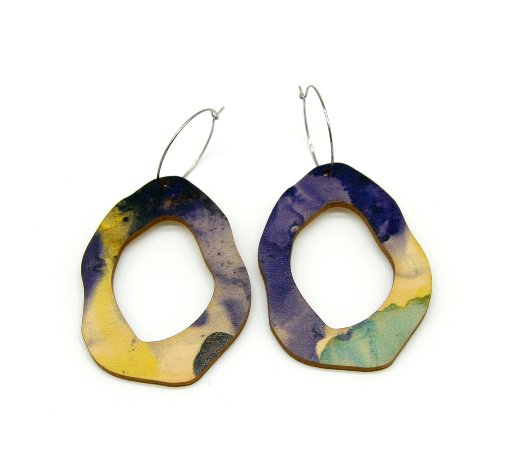Shop women's wooden earrings named ‘Rock Hollow Light’ shaped as a natural rock. Made from sustainable wood with stainless steel hoops. Made in Australia.