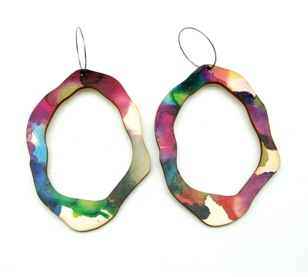 Shop women's wooden earrings named ‘Rock Hollow Play Statement’ shaped as a natural rock. Made from sustainable wood with stainless steel hoops. Made in Australia.