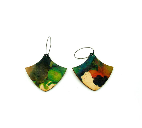 Shop women's wooden earrings named ‘play shield’ shaped as a natural shield. Made from sustainable wood with stainless steel hoops. Made in Australia.