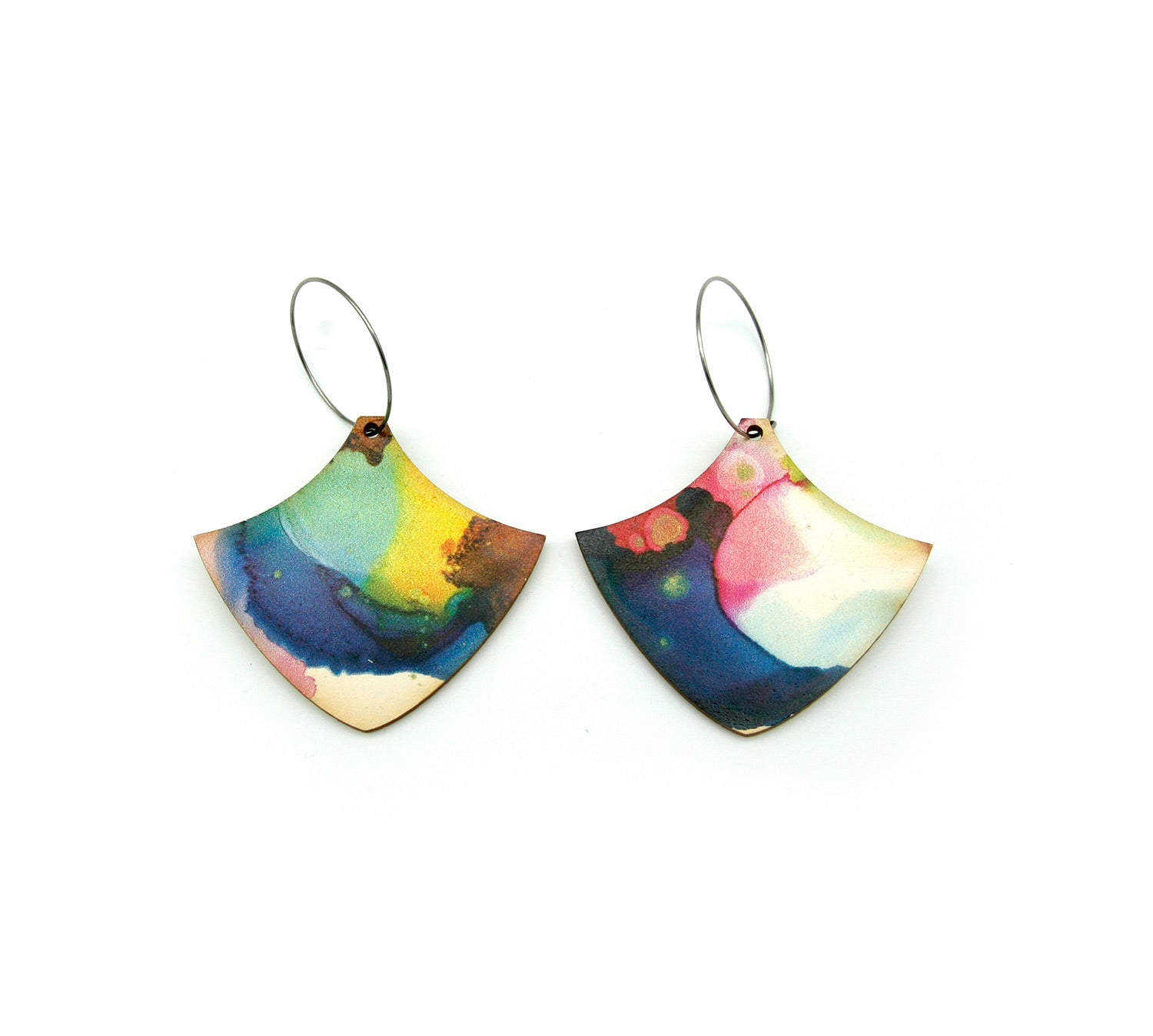 Shop women's wooden earrings named ’Wave Shield’ shaped as a natural shield. Made from sustainable wood with stainless steel hoops. Made in Australia.