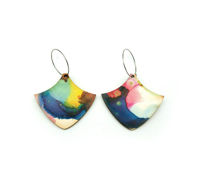 Shop women's wooden earrings named ’Wave Shield’ shaped as a natural shield. Made from sustainable wood with stainless steel hoops. Made in Australia.