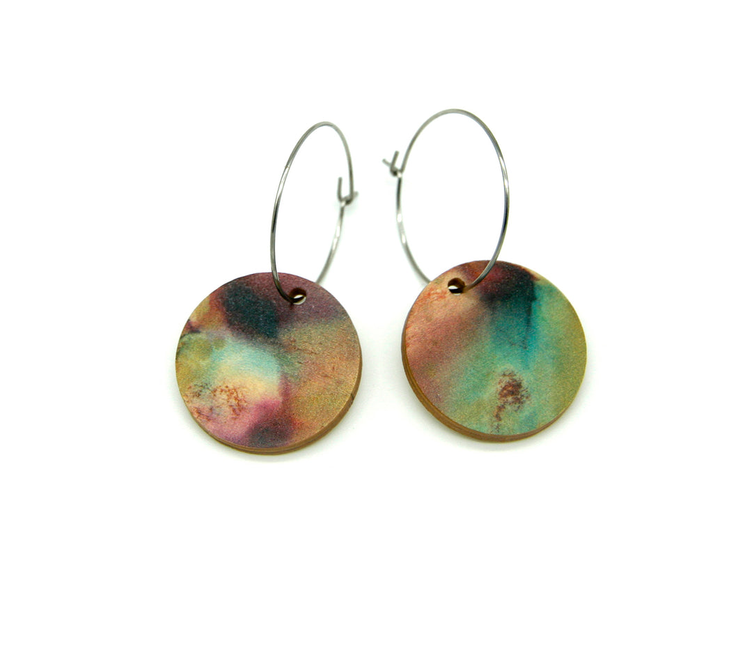 Shop women's wooden earrings named ‘Round 25 Flight’ with a round shape. Made from sustainable wood with stainless steel hoops. Made in Australia.