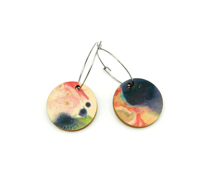 Shop women's wooden earrings named ‘Round 25 Heights’ with a round shape. Made from sustainable wood with stainless steel hoops. Made in Australia.