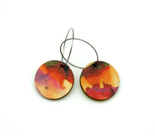 Shop women's wooden earrings named ‘Round 25 Fire’ with a round shape. Made from sustainable wood with stainless steel hoops. Made in Australia.