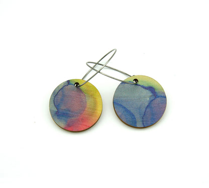 Shop women's wooden earrings named ‘Round 25 Sky’ with a round shape. Made from sustainable wood with stainless steel hoops. Made in Australia.