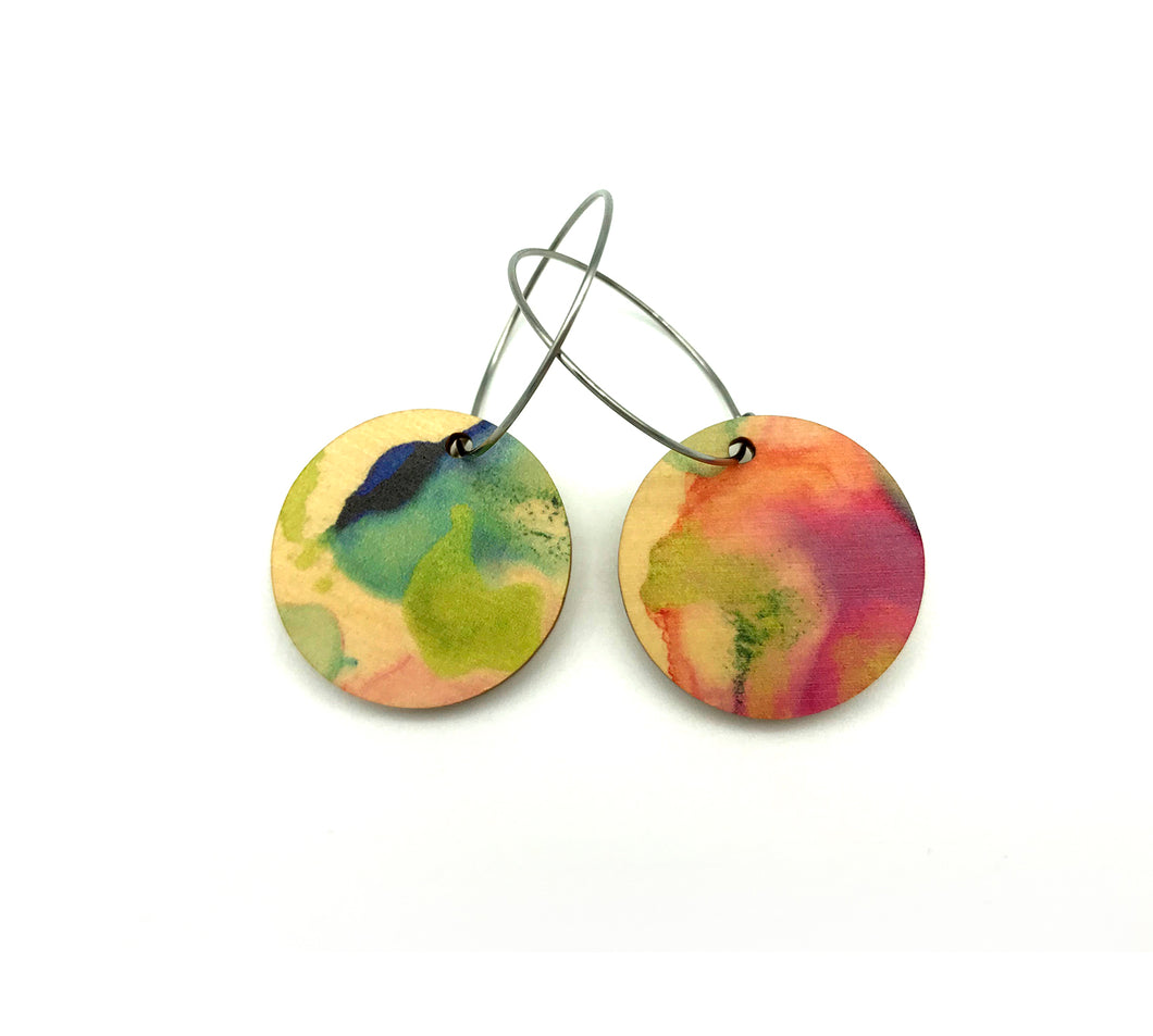 Shop women's wooden earrings named ‘Round 25 Summer’ with a round shape. Made from sustainable wood with stainless steel hoops. Made in Australia.