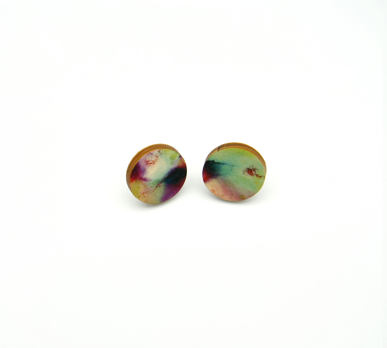 Shop women's wooden earrings named ‘Stud Flight’ with a round shape. Made from sustainable wood with stainless steel backs. Made in Australia.